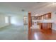 Spacious living room with a view of the kitchen, offering an ideal layout for entertaining and Gathering life at 12220 Twin Branch Acres Rd, Tampa, FL 33626