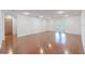 Spacious room featuring wood flooring and access to the outside through sliding doors at 12220 Twin Branch Acres Rd, Tampa, FL 33626