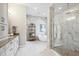 Spa-like bathroom features a glass enclosed shower, soaking tub and custom vanity with ample storage space at 125 Hidden Estates Ct, Brandon, FL 33511