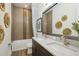 Inviting bathroom features double sinks, modern finishes, and decorative accents creating a warm space at 125 Hidden Estates Ct, Brandon, FL 33511