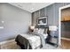 A well-designed bedroom with gray walls, paneling, and ambient lighting creates a serene atmosphere at 125 Hidden Estates Ct, Brandon, FL 33511