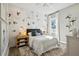 Charming bedroom showcases stylish wallpaper, modern fixtures, and natural light from the window at 125 Hidden Estates Ct, Brandon, FL 33511