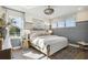 A well-lit bedroom with large windows, neutral tones, and stylish furnishings, creating a peaceful retreat at 125 Hidden Estates Ct, Brandon, FL 33511