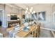 Elegant dining area featuring stylish decor, a large table for entertaining, and modern lighting at 125 Hidden Estates Ct, Brandon, FL 33511