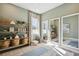 Bright fitness room with mirrored wall, natural light, and shelving offering a serene workout space at 125 Hidden Estates Ct, Brandon, FL 33511