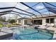 Outdoor screened-in pool and spa with ample seating and well-manicured landscaping at 125 Hidden Estates Ct, Brandon, FL 33511