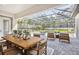 Screened-in pool area with hot tub and outdoor dining space perfect for entertaining guests at 125 Hidden Estates Ct, Brandon, FL 33511