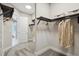 Organized walk-in closet with custom shelving and ample storage space for clothing and accessories at 125 Hidden Estates Ct, Brandon, FL 33511