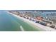 Panoramic aerial view of a beachfront building providing direct access to the beach and beautiful ocean scenery at 14048 Gulf Blvd # 302, Madeira Beach, FL 33708