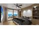 Beautiful bedroom with ocean view, ceiling fan, built-in shelving, and balcony access at 14048 Gulf Blvd # 302, Madeira Beach, FL 33708