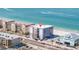Exterior of a beachside building with a scaffolding and beautiful sandy beach and ocean views at 14048 Gulf Blvd # 302, Madeira Beach, FL 33708