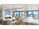 Bright, open-concept living area with ocean views, fireplace, and modern furniture at 14048 Gulf Blvd # 302, Madeira Beach, FL 33708