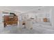 Spacious unfinished room with drywall, storage chest, and sliding glass door at 14048 Gulf Blvd # 302, Madeira Beach, FL 33708