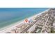 Stunning aerial view of a beachfront property with pristine sandy beach and clear blue ocean waters at 14048 Gulf Blvd # 201, Madeira Beach, FL 33708