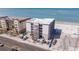 Exterior daytime aerial view of an apartment building under construction near a beach with an oceanfront view at 14048 Gulf Blvd # 201, Madeira Beach, FL 33708