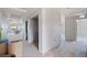 Hallway featuring doorways to additional rooms with protective floor coverings during construction at 14048 Gulf Blvd # 201, Madeira Beach, FL 33708