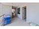 Hallway with freshly painted white walls and floor coverings for protection during the construction process at 14048 Gulf Blvd # 201, Madeira Beach, FL 33708