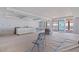 Spacious living room showcasing recessed lighting and sliding glass doors to a future balcony with beach views at 14048 Gulf Blvd # 201, Madeira Beach, FL 33708