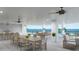 A furnished outdoor terrace overlooking the ocean, offering an amazing space for dining and relaxing with Gathering and friends at 14048 Gulf Blvd # 201, Madeira Beach, FL 33708