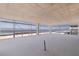An unfinished living space offers sliding doors providing gorgeous beach views, and scaffolding on the outside of the building at 14048 Gulf Blvd # 201, Madeira Beach, FL 33708