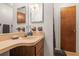 Cozy bathroom with a vanity and sink, towel rack, and wood accents at 14339 Mayer Ave, Hudson, FL 34669