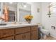 Bright bathroom with a single vanity, sunflower decor, and a step-in shower at 14339 Mayer Ave, Hudson, FL 34669
