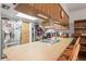 Bright kitchen features stainless steel refrigerator, laminate countertops and an undermount stainless steel sink at 14339 Mayer Ave, Hudson, FL 34669