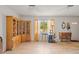 Bright living room features wood-look flooring and plenty of natural light at 14339 Mayer Ave, Hudson, FL 34669