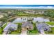Overhead view of home showcasing large backyard, pool, landscaping, and pond at 1443 Obear Ct, Wesley Chapel, FL 33543