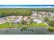Beautiful home features lake view and lush landscaping at 1443 Obear Ct, Wesley Chapel, FL 33543