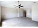 Spacious room with carpet, a ceiling fan, and a closet for storage at 1443 Obear Ct, Wesley Chapel, FL 33543