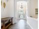 Open foyer with elegant lighting and decorative furniture at 1443 Obear Ct, Wesley Chapel, FL 33543