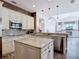 Bright kitchen with granite countertops, stainless steel appliances, and custom cabinets overlooking living space at 1443 Obear Ct, Wesley Chapel, FL 33543