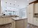 Spacious kitchen featuring granite countertops, stainless steel appliances, and custom white cabinets at 1443 Obear Ct, Wesley Chapel, FL 33543