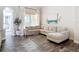 Bright living room with a large sectional couch, decorative rug, and a wall art piece at 1443 Obear Ct, Wesley Chapel, FL 33543