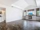 Bright living room features tile flooring, decorative fireplace, media center and large windows with natural light at 1443 Obear Ct, Wesley Chapel, FL 33543