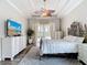 Comfortable bedroom featuring elegant furniture, ceiling fan, and sliding glass doors that provides pool views at 1443 Obear Ct, Wesley Chapel, FL 33543