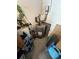 Utility room featuring a water heater and storage space, providing essential home maintenance features at 1559 San Roy Dr, Dunedin, FL 34698