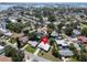 Overhead view showcasing the neighborhood's layout with trees, homes and pool at 1598 Brookside Blvd, Largo, FL 33770