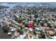 Waterfront property with access to the ocean featuring lush landscaping and mature trees surrounding the neighborhood at 1598 Brookside Blvd, Largo, FL 33770