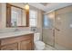 Bathroom featuring a walk-in shower, vanity, and plenty of natural light at 1598 Brookside Blvd, Largo, FL 33770