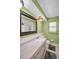 Bathroom featuring a decorative-framed mirror, and neutral-colored walls at 1598 Brookside Blvd, Largo, FL 33770