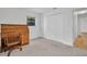Bedroom featuring a window, closet, and roll top desk with chair at 1598 Brookside Blvd, Largo, FL 33770