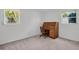 Bedroom with two windows and a roll top desk with chair at 1598 Brookside Blvd, Largo, FL 33770