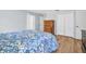 Comfortable bedroom featuring wood-look flooring, a closet, and natural light at 1598 Brookside Blvd, Largo, FL 33770