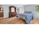 Charming bedroom with wood floors and large dresser at 1598 Brookside Blvd, Largo, FL 33770