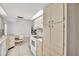 Bright kitchen featuring white appliances and a tile floor with a dining area at 1598 Brookside Blvd, Largo, FL 33770