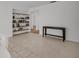 Spacious open floor plan with tile floors, bookcase and console table at 1598 Brookside Blvd, Largo, FL 33770