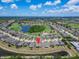 Stunning aerial view of the community showing the home's placement and golf course views at 1643 Emerald Dunes Dr, Sun City Center, FL 33573
