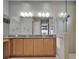 The bathroom features a double vanity, granite countertops, and a glass walk-in shower at 1643 Emerald Dunes Dr, Sun City Center, FL 33573